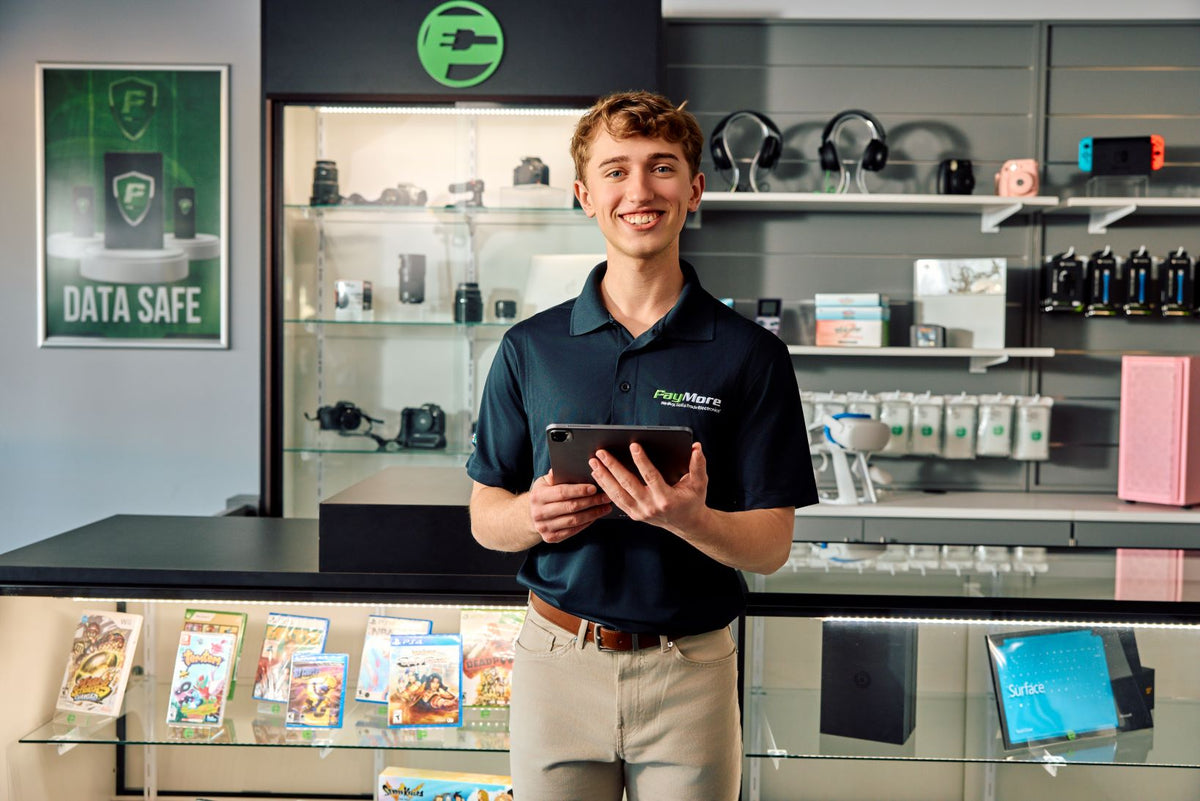 employee holding tablet and smiling